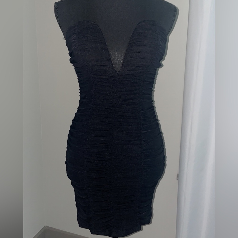 Size 1 little black dress, with a V shape open in the front
